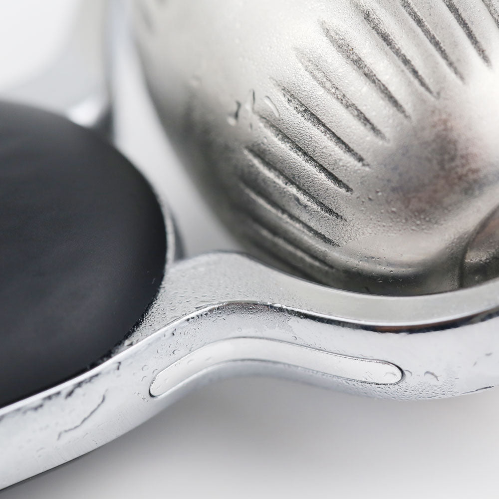 Close-up view of the Cold Therapy EMS Dual Roller showing the textured metal cryo ball and smooth microcurrent pad.