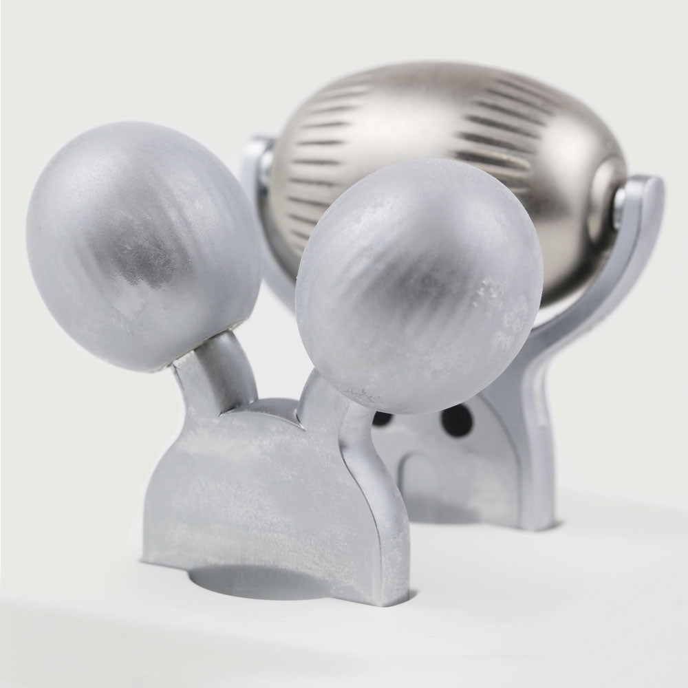 Interchangeable roller heads of the re-nū Cold Therapy EMS Dual Roller, including wide cooling roller for cryo therapy and dual-sphere EMS V-roller for facial sculpting, displayed side by side and frozen on a clean surface.