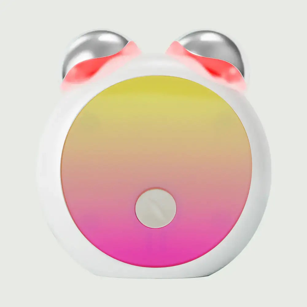 Front view of Compact LED Facial Toning Massager from re-nū Smart Beauty showing sleek, ergonomic shape and dual LED light area