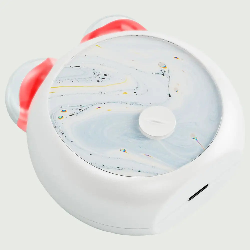 Top angled view of the compact LED Facial Toning Massager, front view showing the smooth, ergonomic design with visible LED light High Frequency Microcurrent EMS massage rollers.