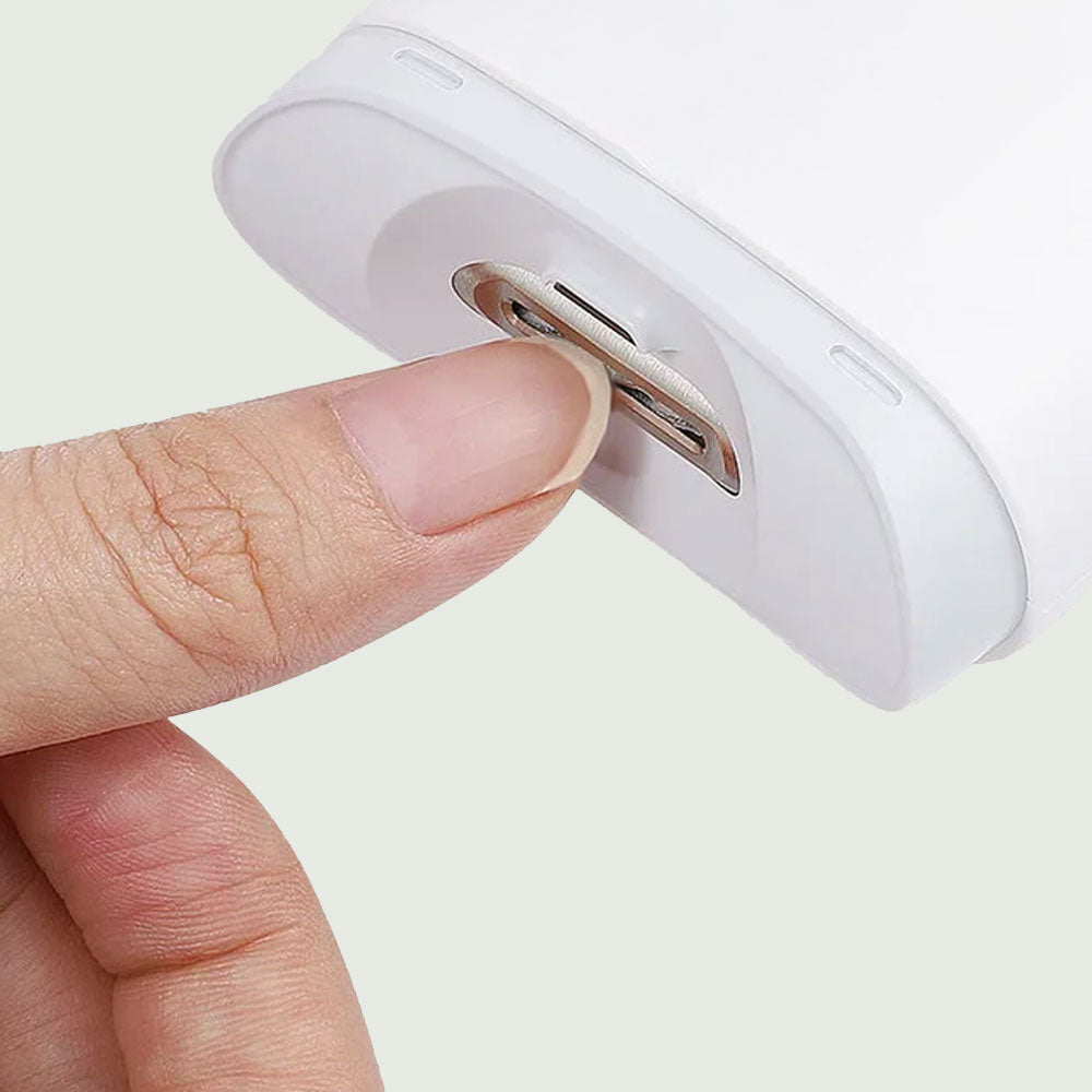 Close-up of person trimming thumbnail with Electric Mini Nail Clipper for smooth, gentle grooming