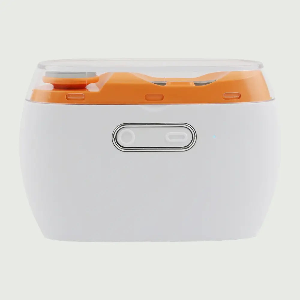 Electric nail trimmer with polisher on a surface, showing full device with lid and power button