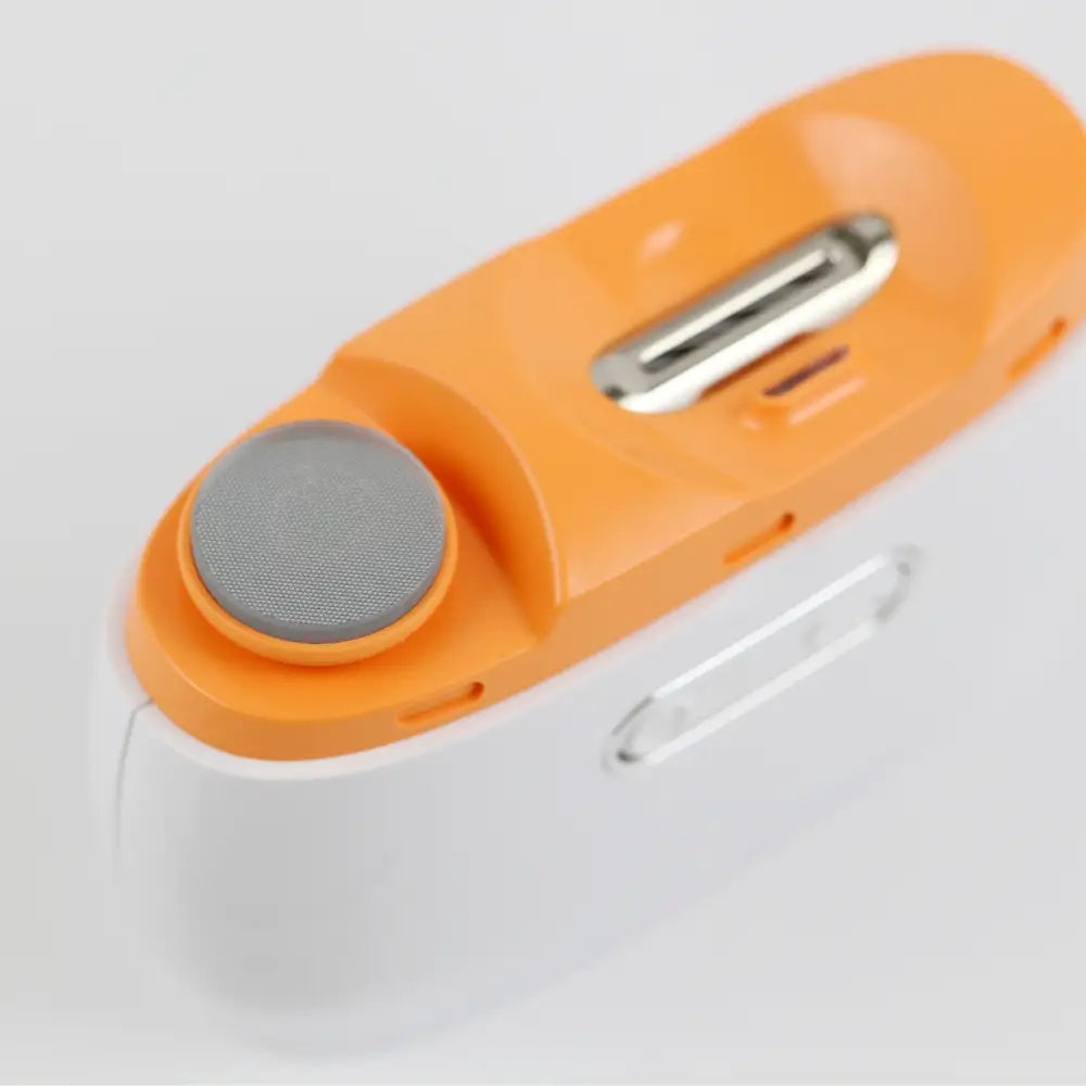 Electric nail trimmer with polisher, angled view showing device design and polishing head.