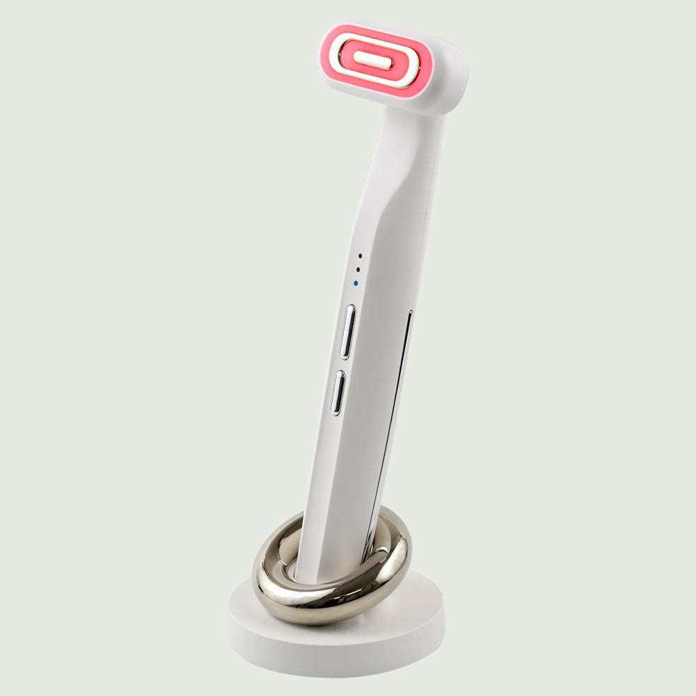 GlowUp 360° LED light therapy wand with ergonomic design and charging base, ideal for facial skin rejuvenation and anti-aging treatment.