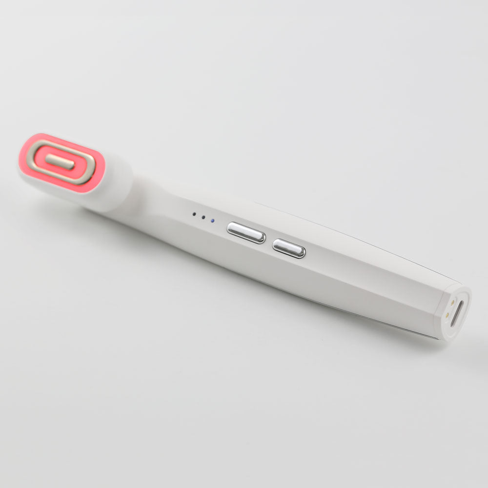 Top-down flat view of the GlowUp 360° LED light therapy wand with ergonomic design and charging base, ideal for facial skin rejuvenation and anti-aging treatment.