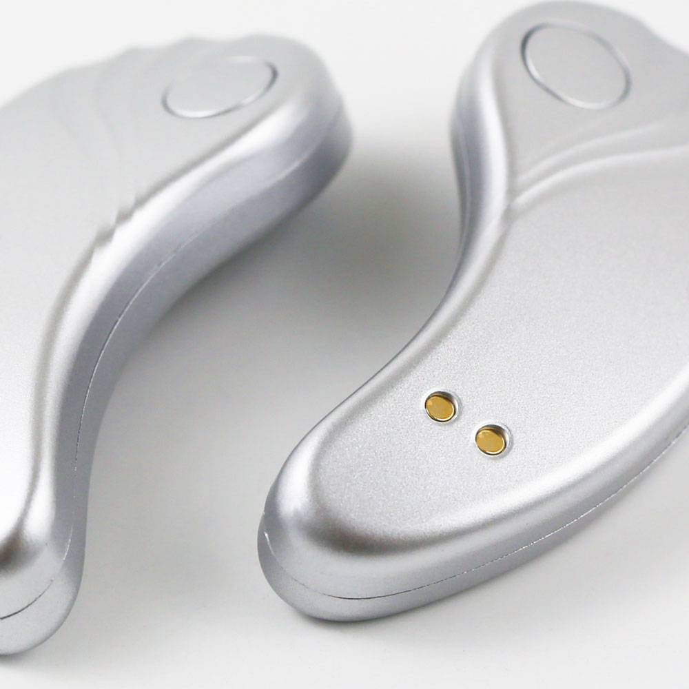 Close-up view of the GlowUp LED/EMS Under Eye Anti-Aging Pads, featuring a sleek silver design engineered for comfort and reusability.