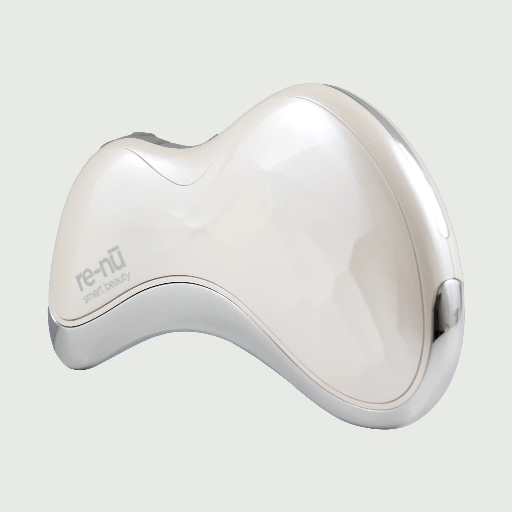 Angled 3/4 view of the Heated Sonic Gua Sha Facial Massager, showcasing the ergonomic design and smooth, sculpting edges.