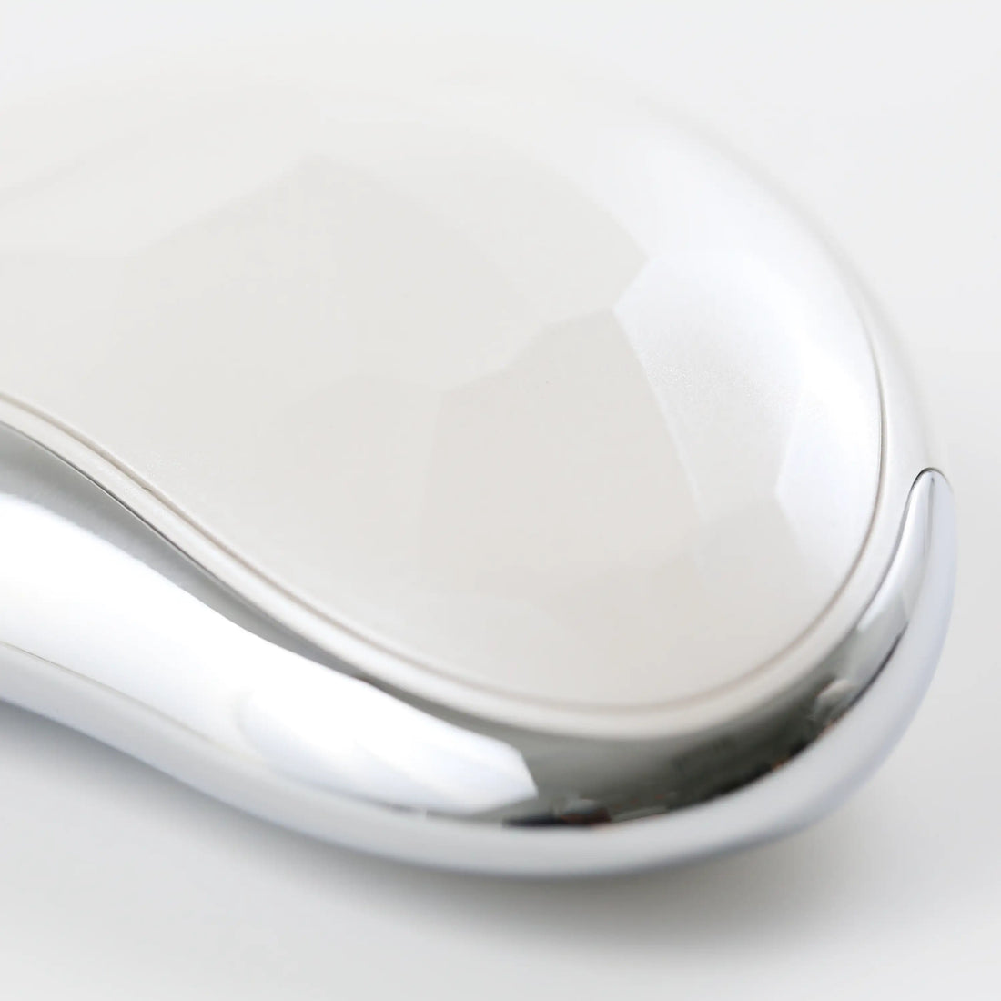 Close-up of the Heated Sonic Gua Sha Facial Massager, highlighting the premium finish, smooth edges, and refined design details.
