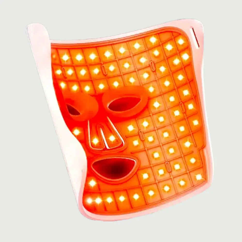 Inside view of the LED Beauty Mask, showing the glowing red LEDs illuminating the mask's surface for therapy.