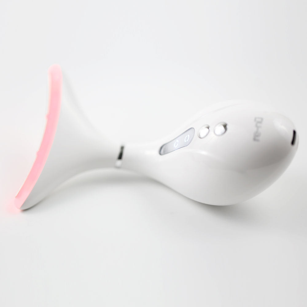 360° LED Lift & Sculpt – laying flat with device head positioned on the left and docking base placed on the right, showcasing full product layout

