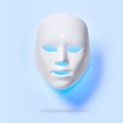 LED light therapy facial mask with blue glow, designed to reduce acne, fine lines, and rejuvenate skin tone.