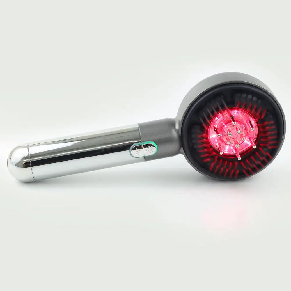 Side view of the LED Therapy Massage Comb showing red light LEDs activated, highlighting ergonomic handle and sleek design.