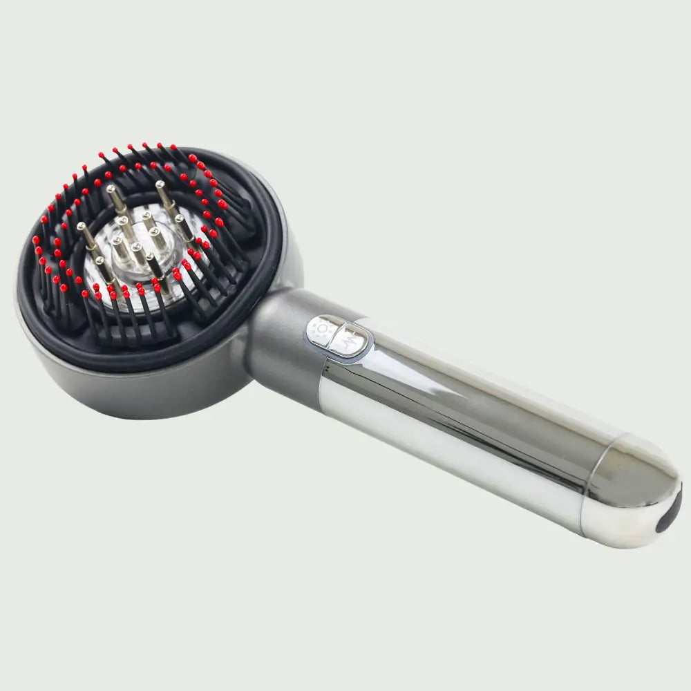 Side view of the LED Therapy Massage Comb showing bristles, highlighting ergonomic handle, sleek design and easy to use controls.