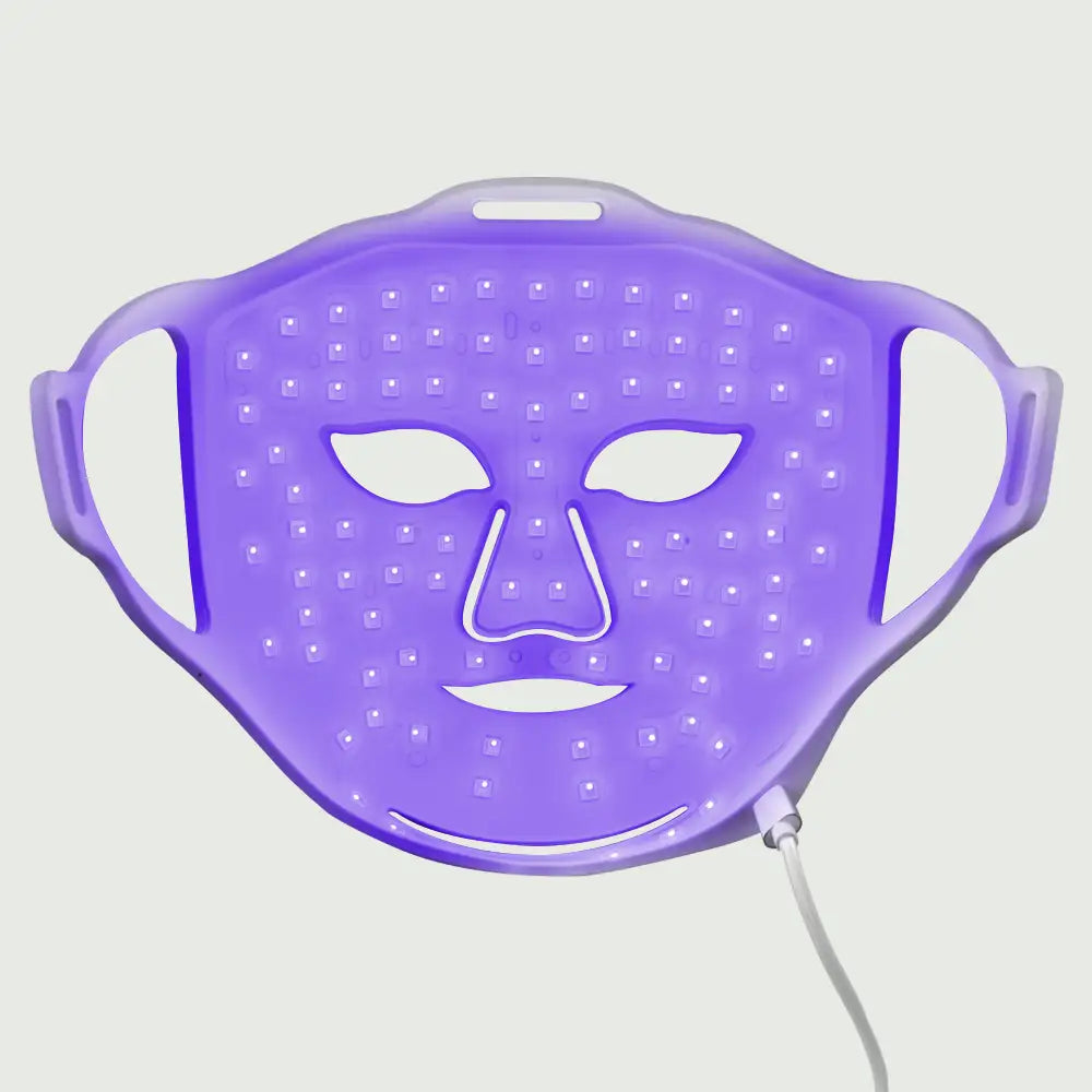 re-nū Liquid Silicone LED Mask illuminated blue showing targeted light treatment