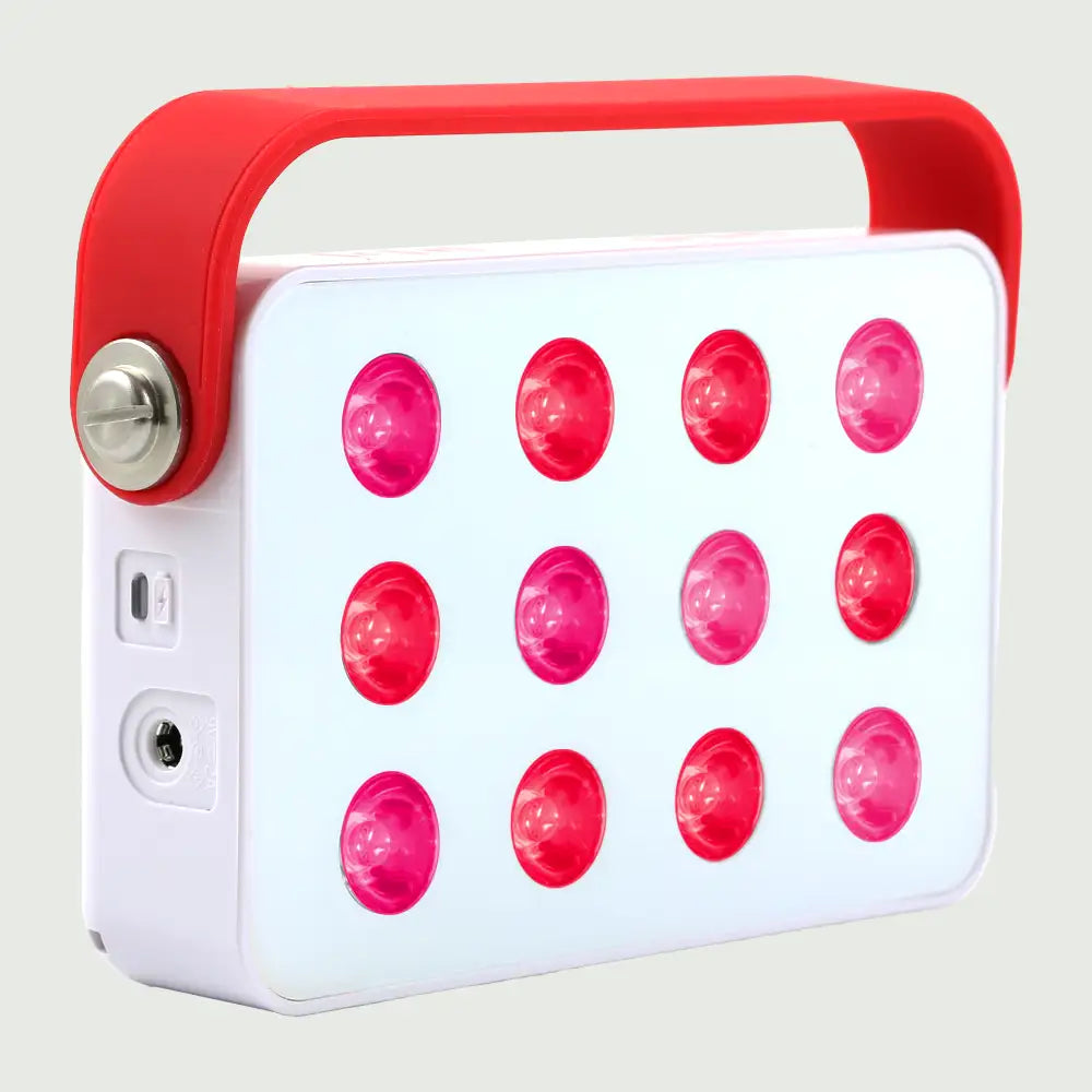 Angled view of the Mini LED Red Light Panel with red and near-infrared lights on