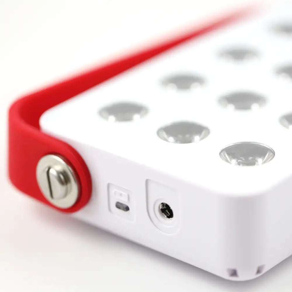 Mini LED Red Light Panel side view showing flexible rubber strap and durable pivoting collar for adjustable positioning