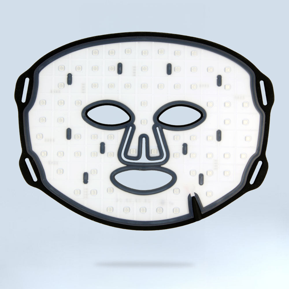 Flat lay of the re-nū Smart Beauty LED Light Therapy Mask showing the interior with visible LED light nodes and eye openings, highlighting the technology within.