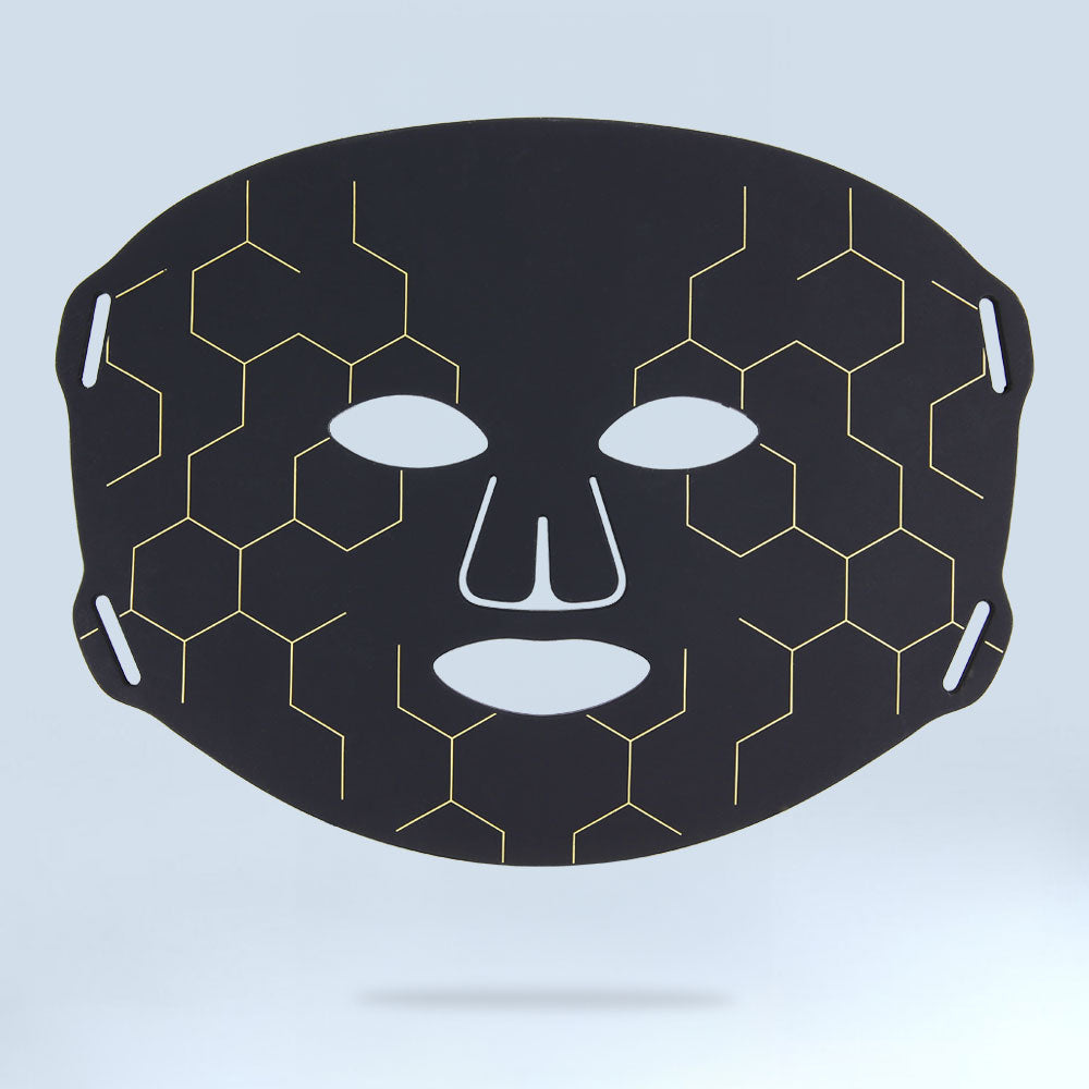 Flat lay of the re-nū Smart Beauty LED Light Therapy Mask with controller, presented in a knolling photography style for a clean, organized look