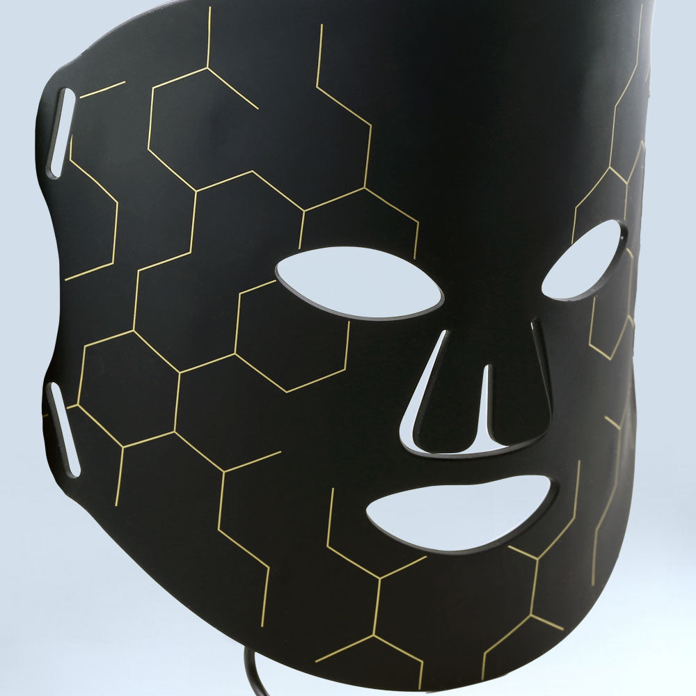 Close-up view of the re-nū Smart Beauty LED Light Therapy Mask, showing fine detailing around the eye area and smooth surface finish.