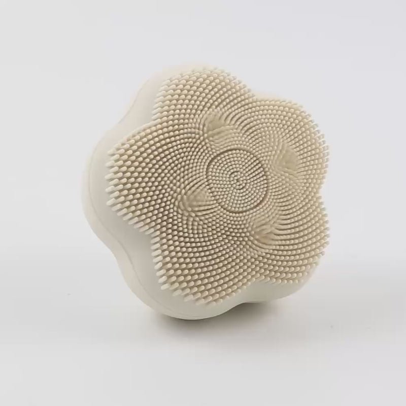 Angled video of the Rotating Sonic Cleansing Brush, highlighting the ergonomic shape, silicone bristles, and rotating massage beads in action