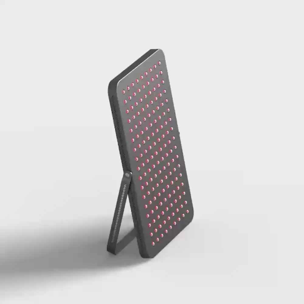 Load video: Video of the UltraThin LED Red Light Therapy Panel shown in 360 degree spin, with stand and red bright LEDs.