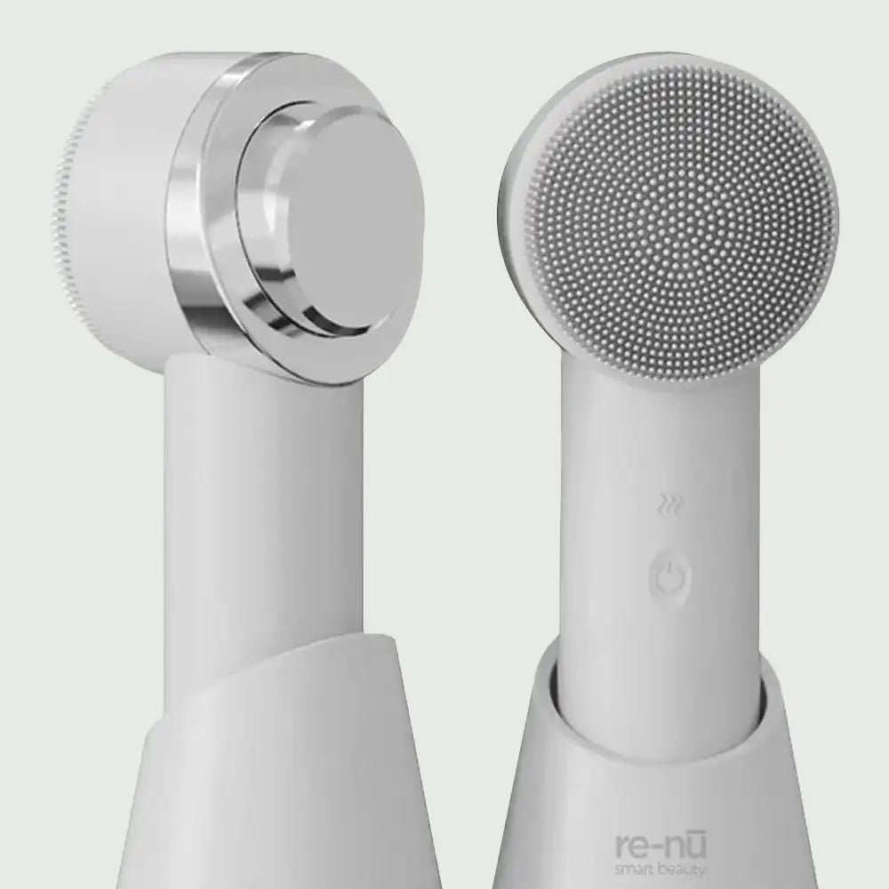 Close-up of PurePulse Elite Sonic Brush head with soft silicone bristles and visible power-off button, showcasing ergonomic design for deep cleansing and skin glow