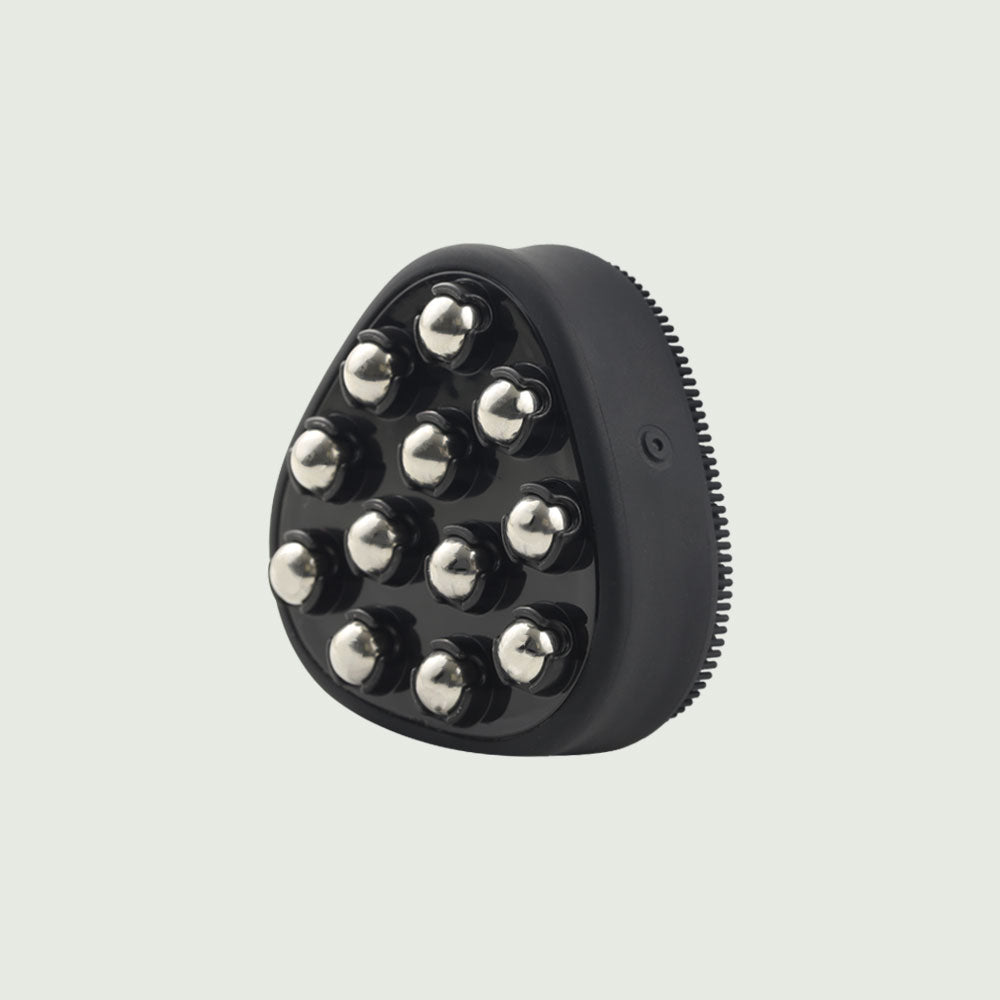 Back view of the black PurePulse Pro Sonic Cleansing Brush featuring 12 rounded metal massage nodes, designed for facial toning and improved blood circulation.