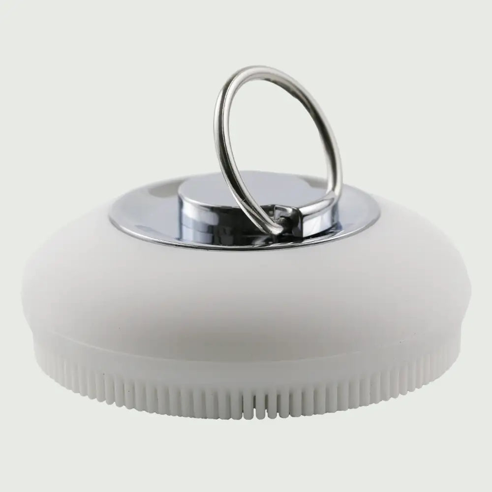 Closeup view of the PurePulse Sonic Cleansing Brush showing it's textured bristles and silver ring handle, for deep pore cleansing and gentle exfoliation.