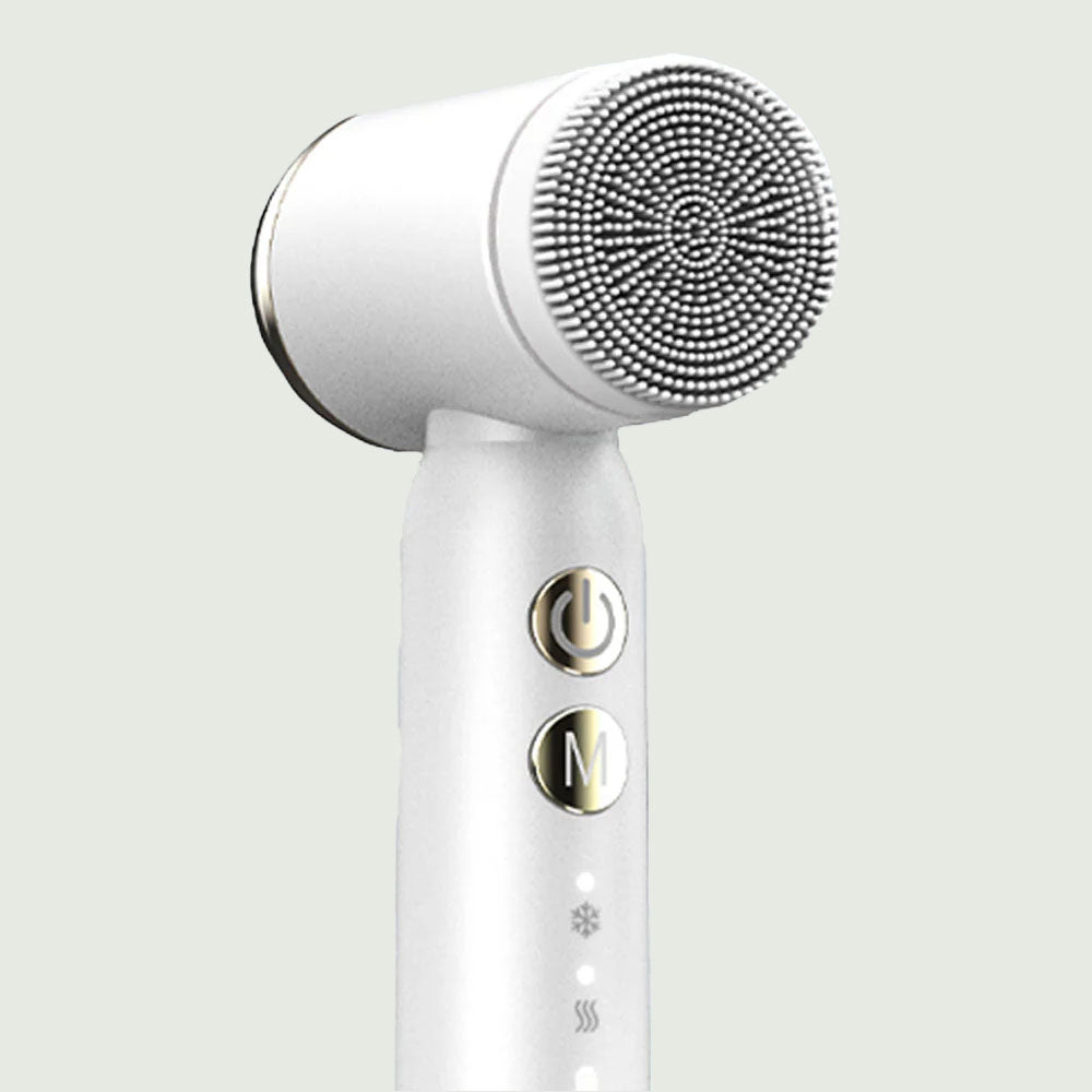 Closeup view of the PureSpin Multi-Function Cleansing Brush with detachable brush heads on display