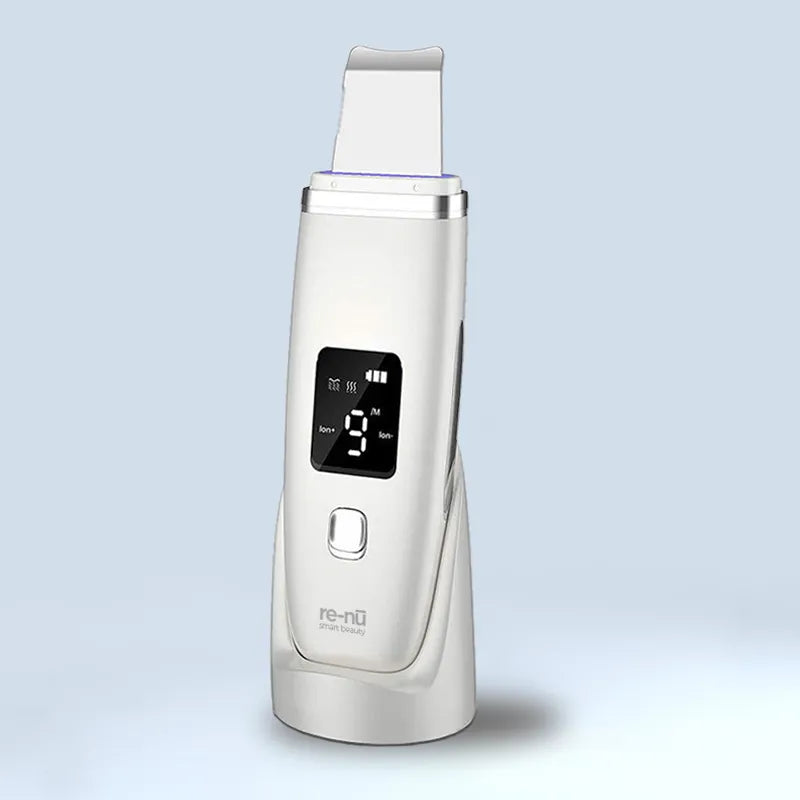 A white Re-Nu ultrasonic skin scrubber with digital display and stainless steel spatula head, designed for deep facial cleansing, blackhead removal, and exfoliation.

