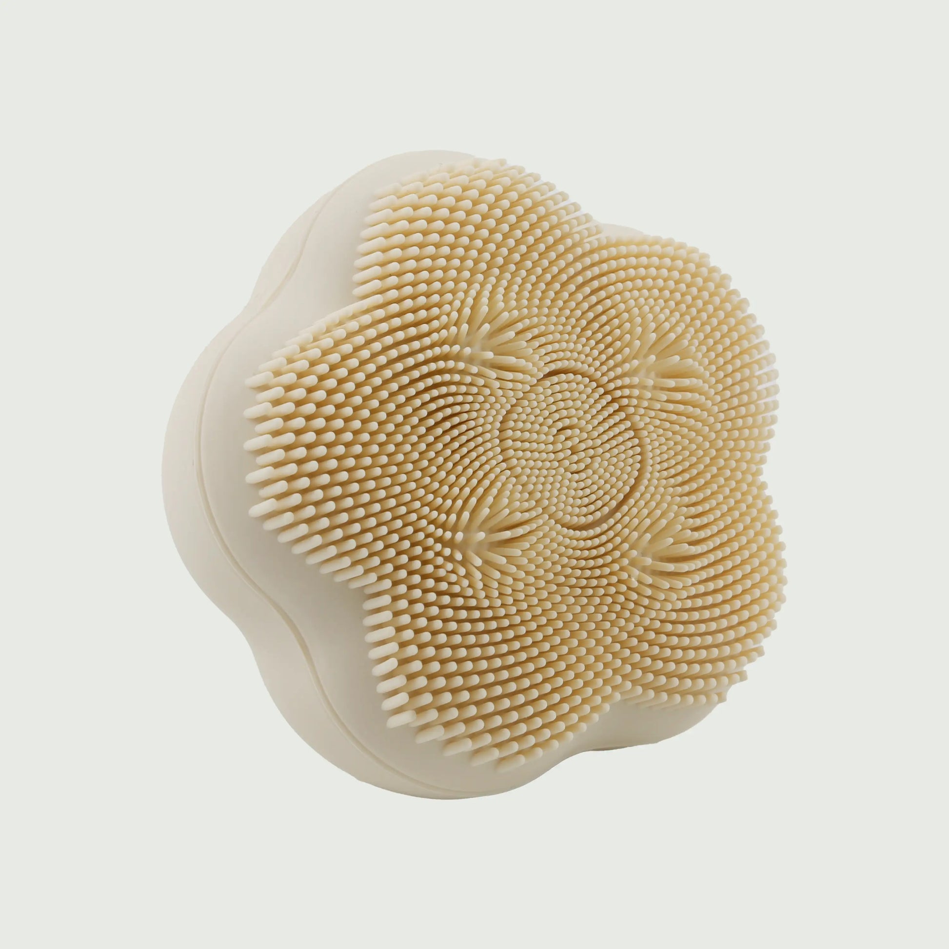 Angled view of the Rotating Sonic Cleansing Brush, highlighting the ergonomic shape, silicone bristles, and rotating massage bead design.