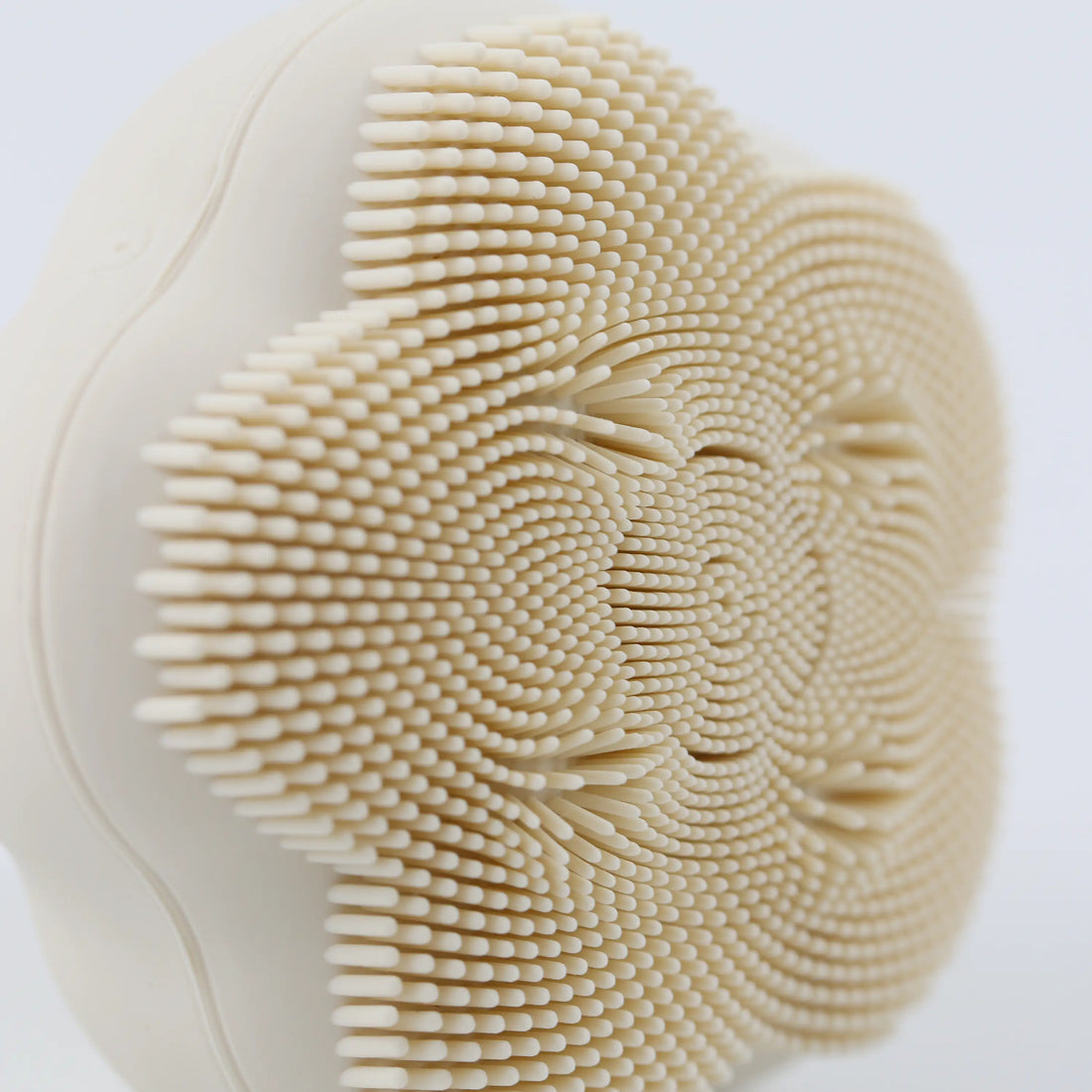 Close-up detail of the soft silicone bristles on the brush head, highlighting their texture and density for gentle cleansing.