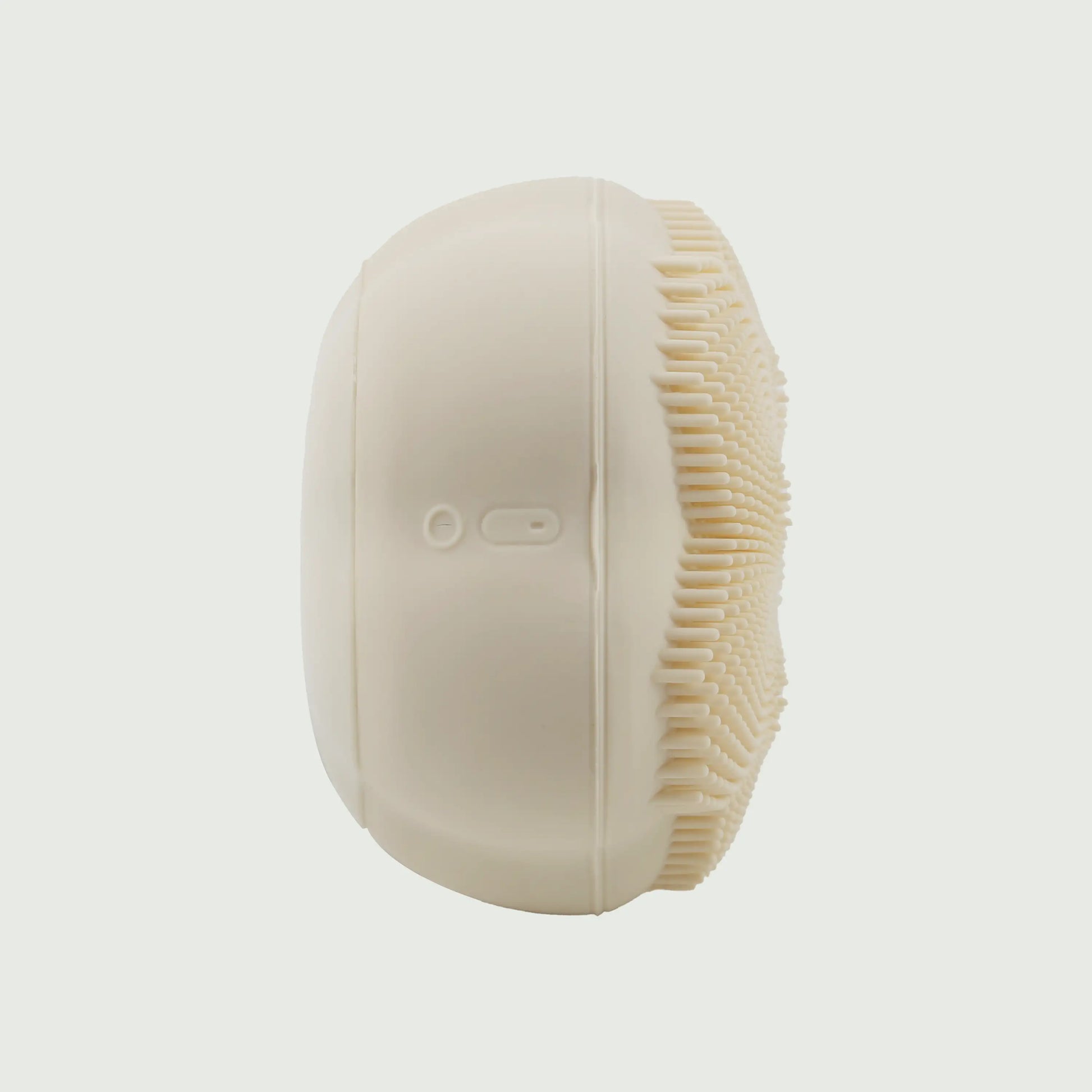 Side profile of the Rotating Sonic Cleansing Brush showing the power button, USB-C charging port, and slim ergonomic design for easy handling.