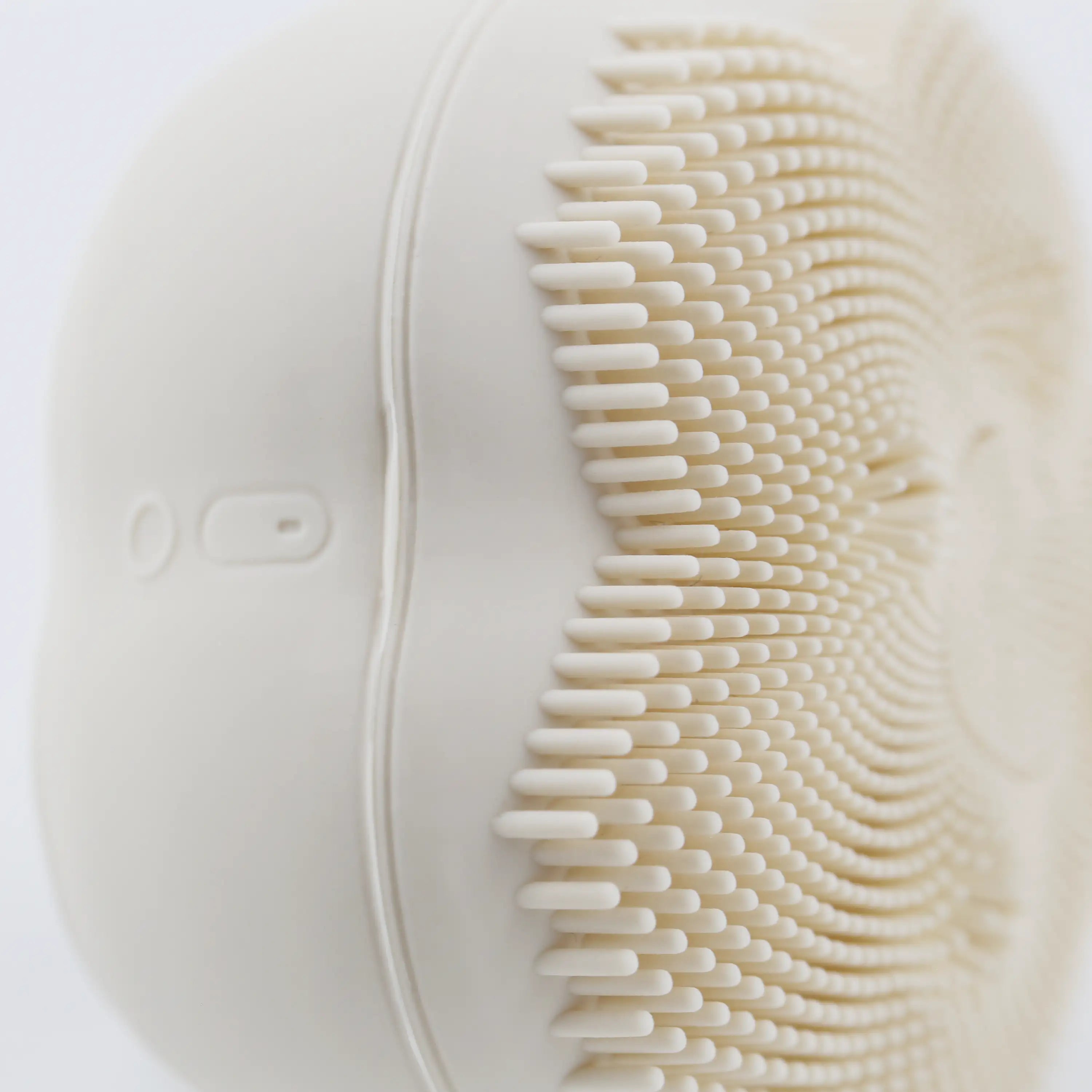 Extreme close-up of the waterproof USB-C charging port on the sonic facial cleansing brush, showcasing the sealed protective design and detailed charging interface.