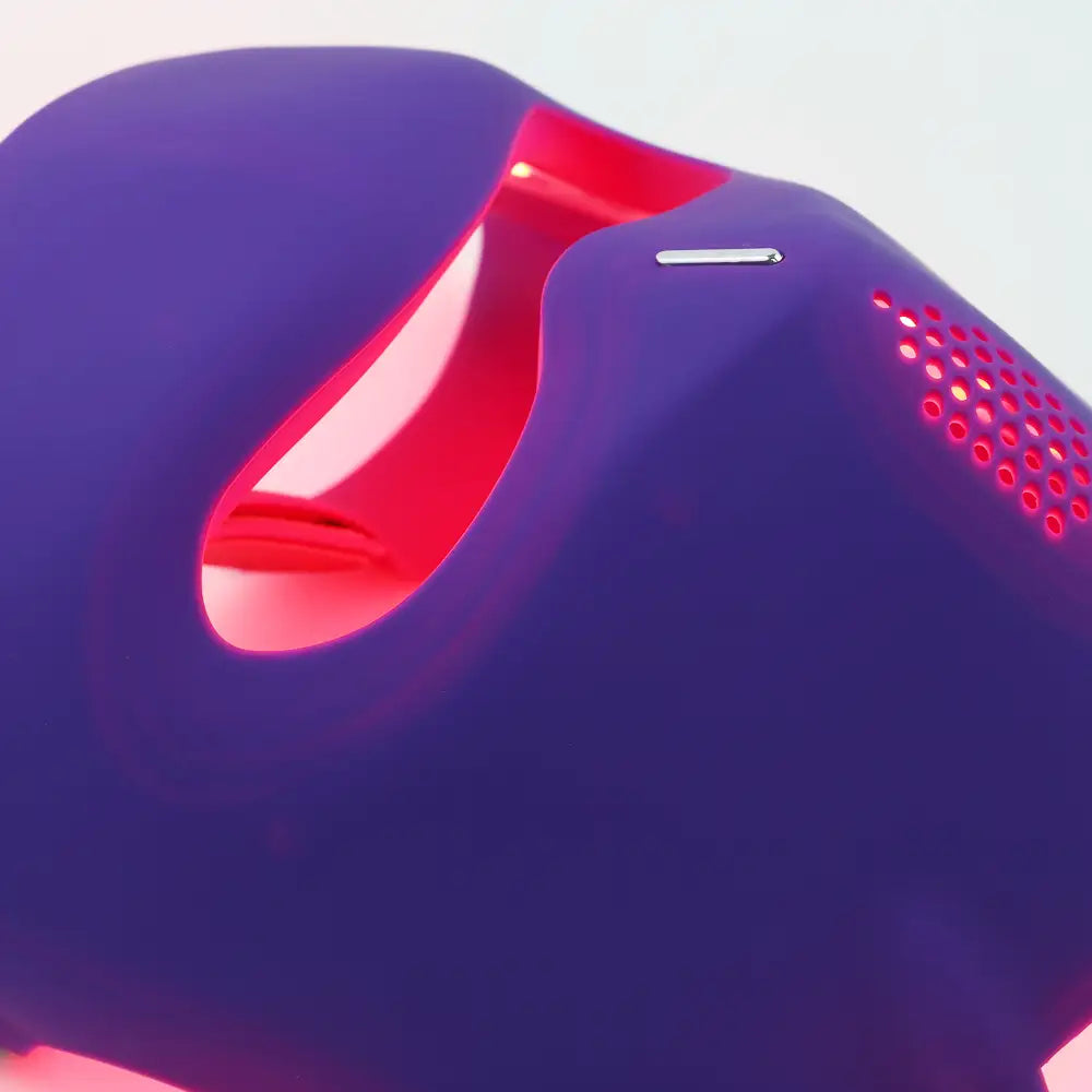 re-nū Silicone LED Face Mask glowing red light mode for at-home light care