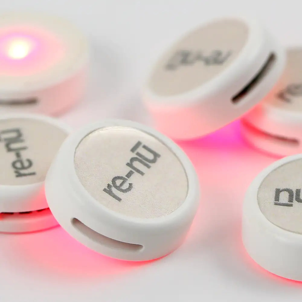 Closeup of the re-nu Smart LED Patches, highlighting its powerful Red LED base and pull-tab slot.