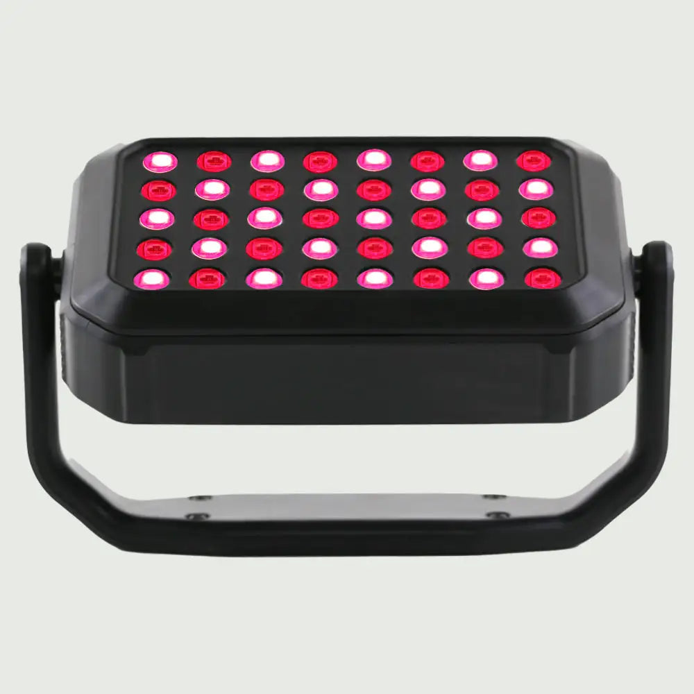 Angled view of the UltraCompact LED Red Light Therapy Panel tilted upward on its stand, emphasizing its slim, portable design.