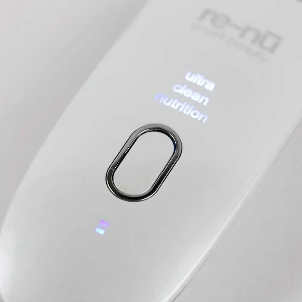 Closeup of the re-nū Ultrasonic Scrubber with Wireless Charge Base, detailing the easy-to-use power button and mode section. 