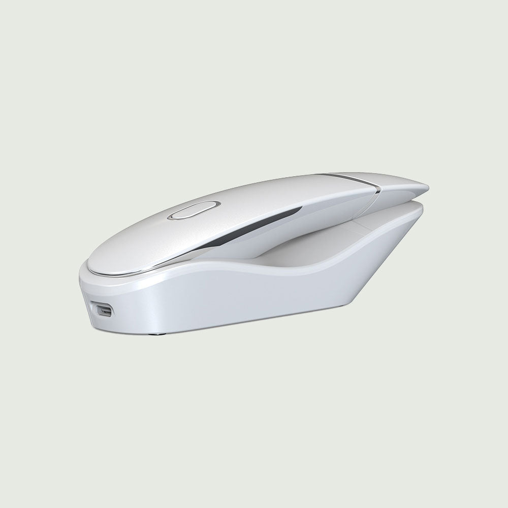 A white Ultrasonic Scrubber mouse positioned on a blue surface, highlighting its sleek design and modern technology.