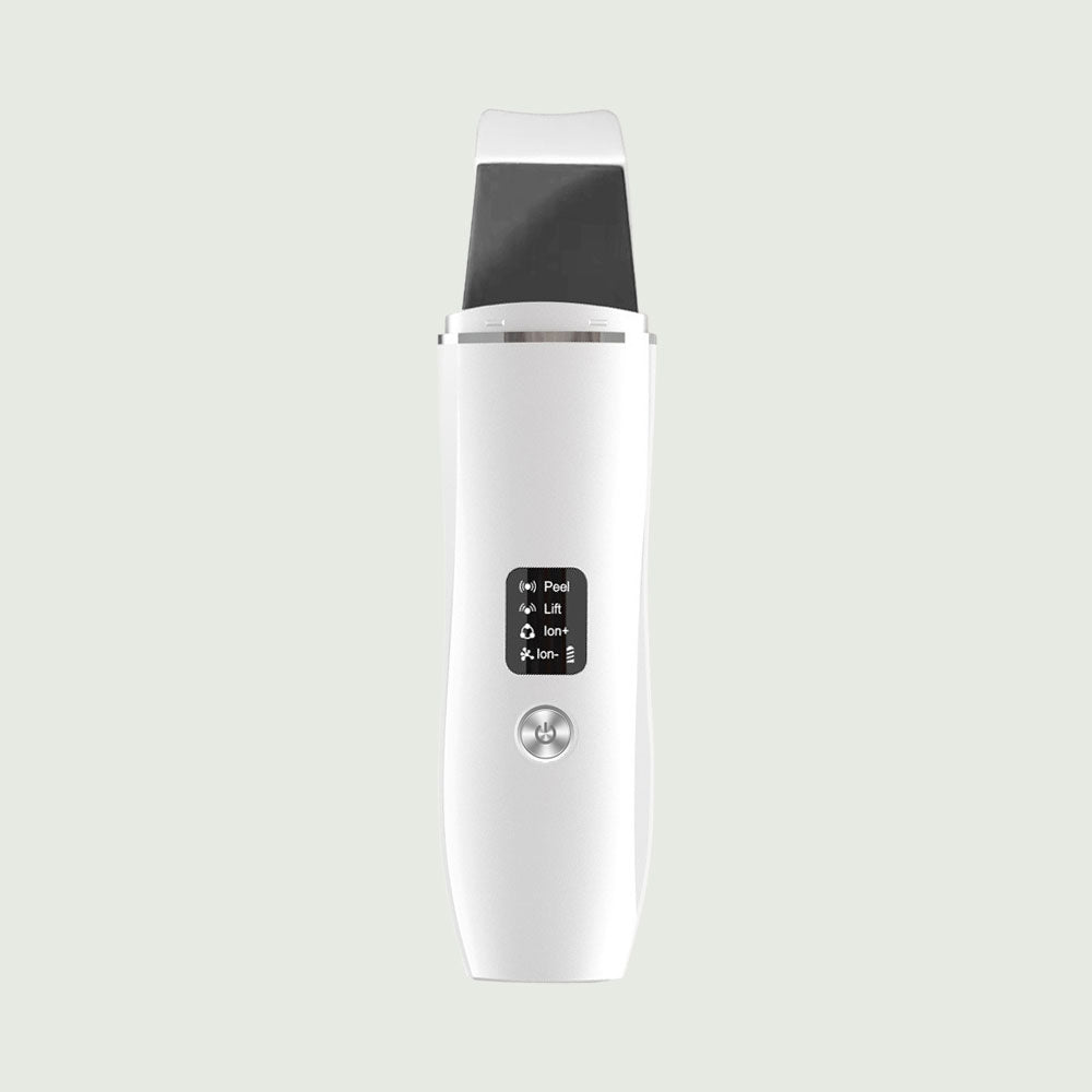 White Ultrasonic Skin Scrubber with stainless steel spatula head and LED display, designed for deep pore cleansing and facial exfoliation.