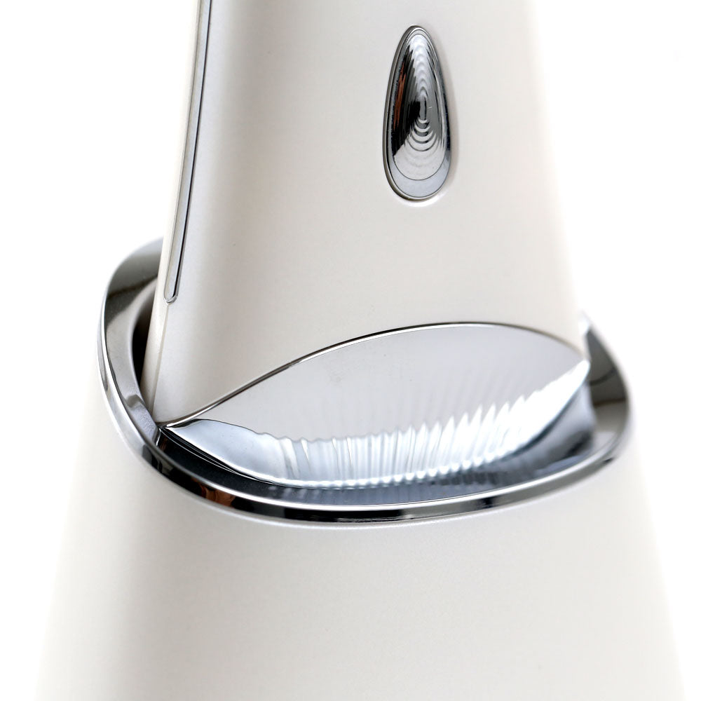 Closeup view of the Ultrasonic Skin Scrubber with UV Base, showing its wireless UV charging system and ergonomic shaped handle.