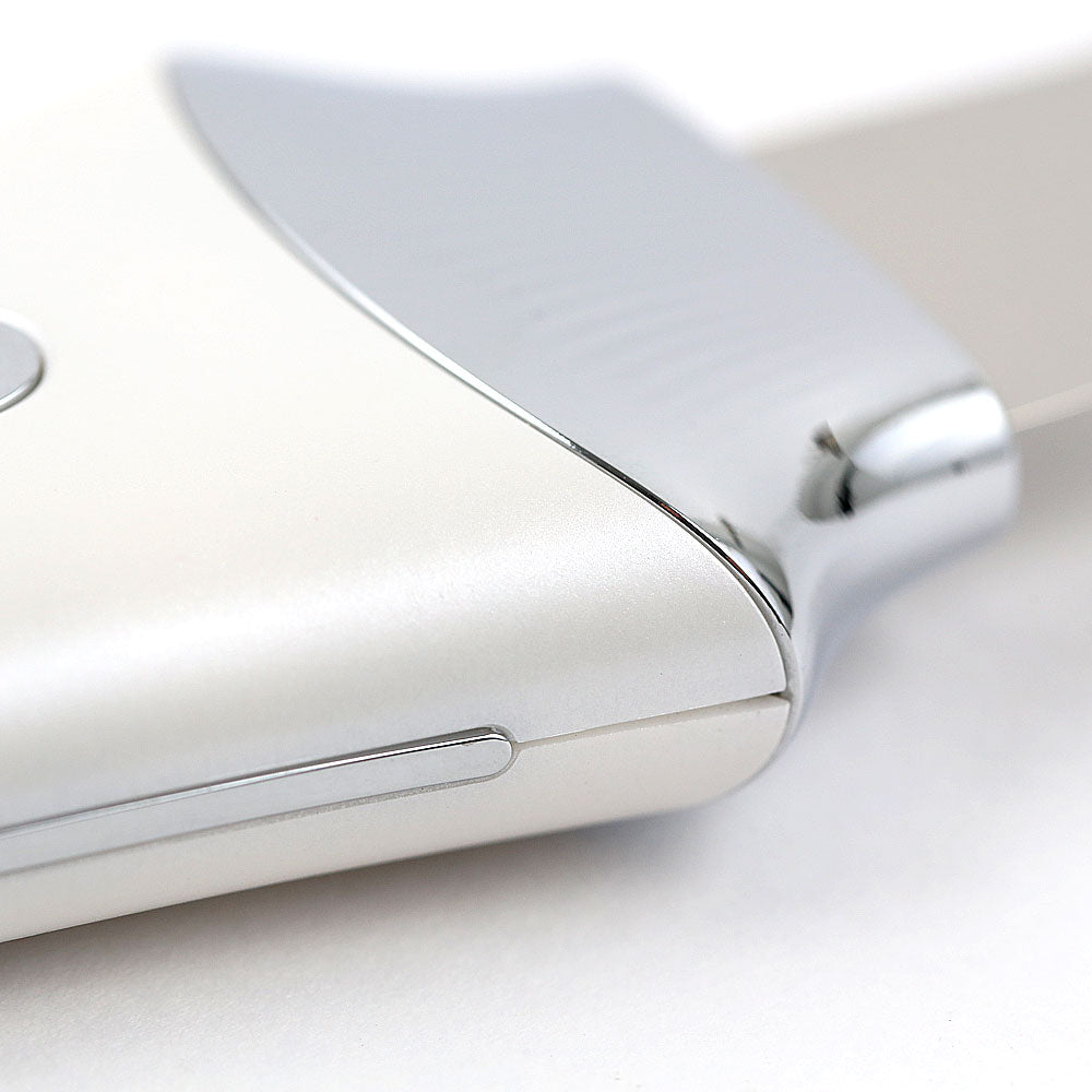 Closeup view of the Ultrasonic Skin Scrubber with UV Base, highlighting the sleek waterproof device and stainless details. 