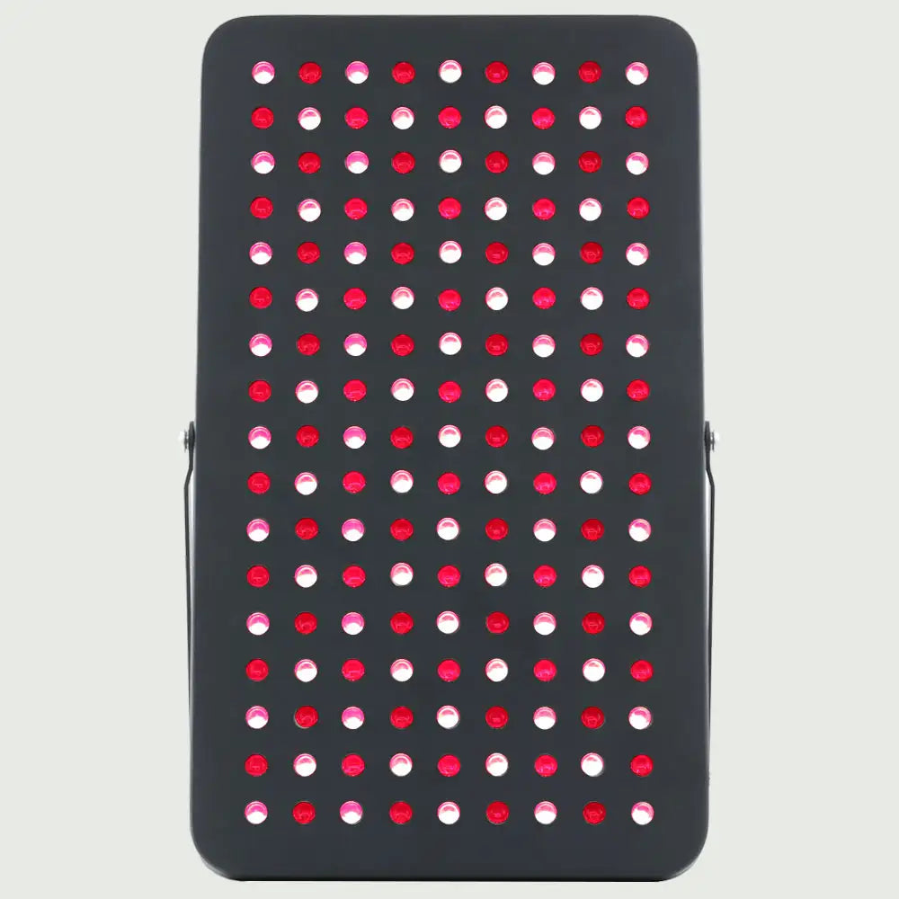 Front view of the LED Red Light Therapy Panel Elite – UltraThin, fully lit with red and near-infrared LED modes, supported by its stand and showcasing its slim, modern design.